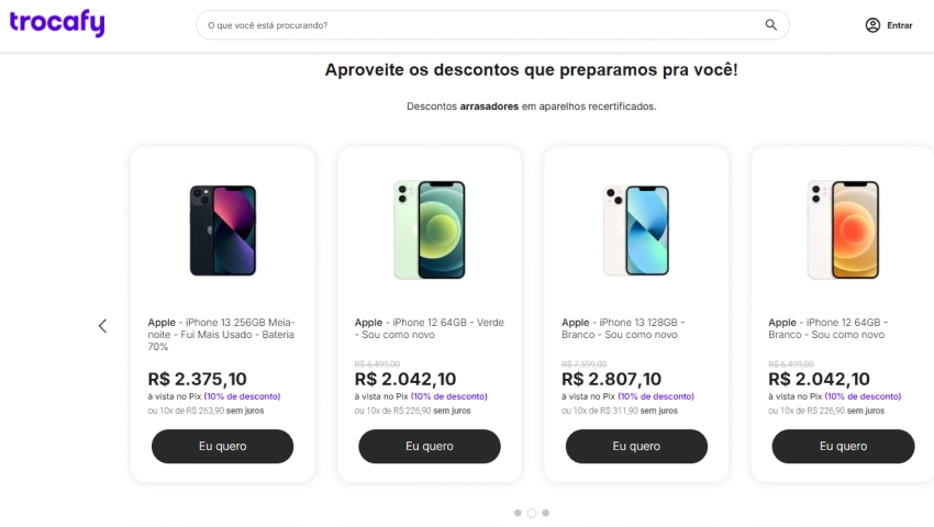 Página inicial da Trocafy com diversos iPhones em promoção, incluindo modelos iPhone 12 e 13 seminovos com preços promocionais e botão “Eu quero”.